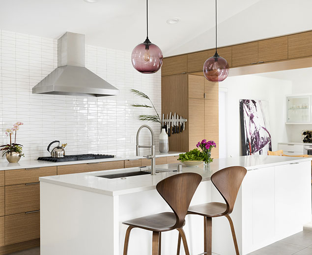 Minimalist and modern kitchen remodel with white walls and no upper cabinets and clean lines.