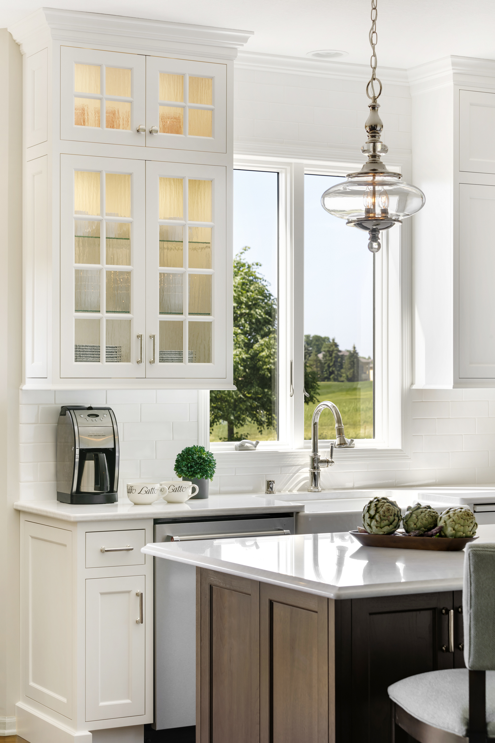 Kitchen remodel with white and glass paneled upper cabinets