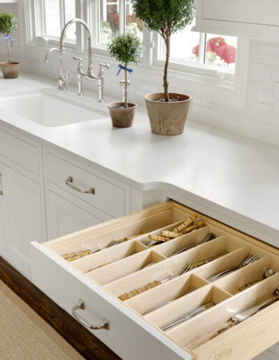 Drawer with silverware storage in kitchen remodel with white cabinets