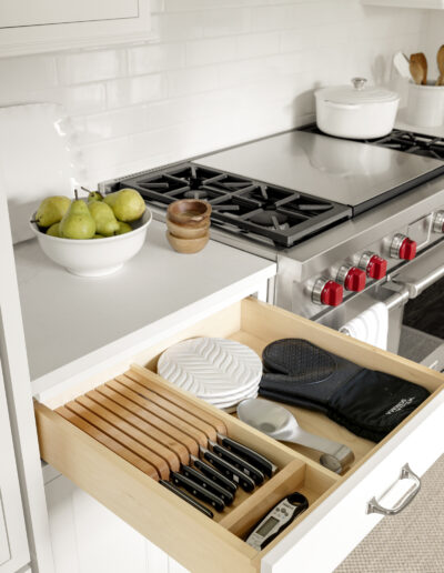 Drawer with knife and accessory storage in kitchen remodel with white cabinets
