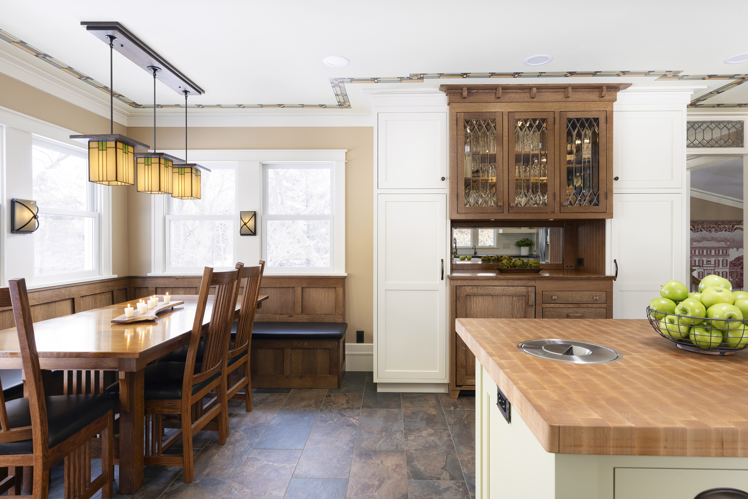 Kitchen remodel with butcher block island, built in craftsman hutch, and custom bench dining seating