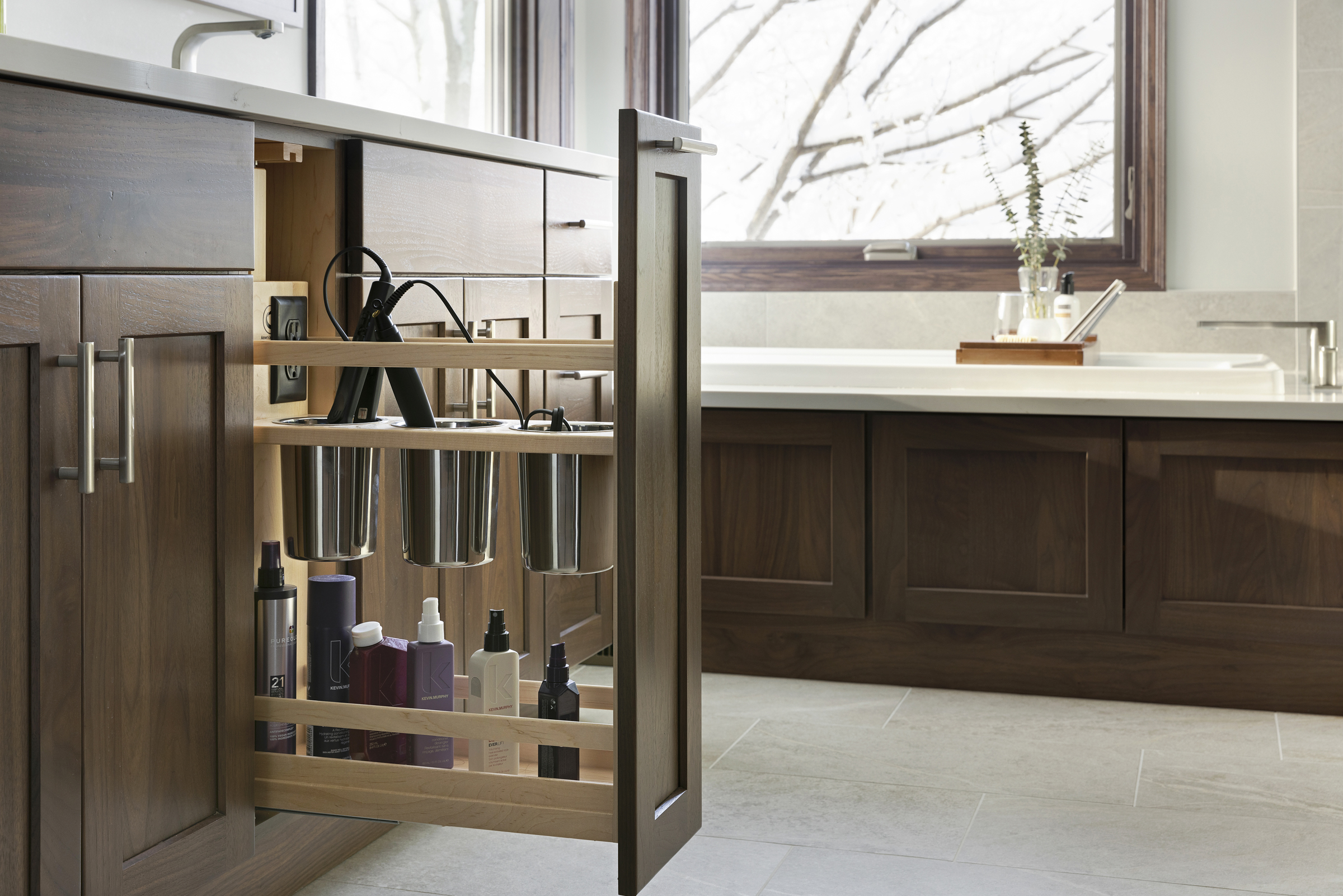 Primary bathroom remodel with dark cabinet with pull out organization