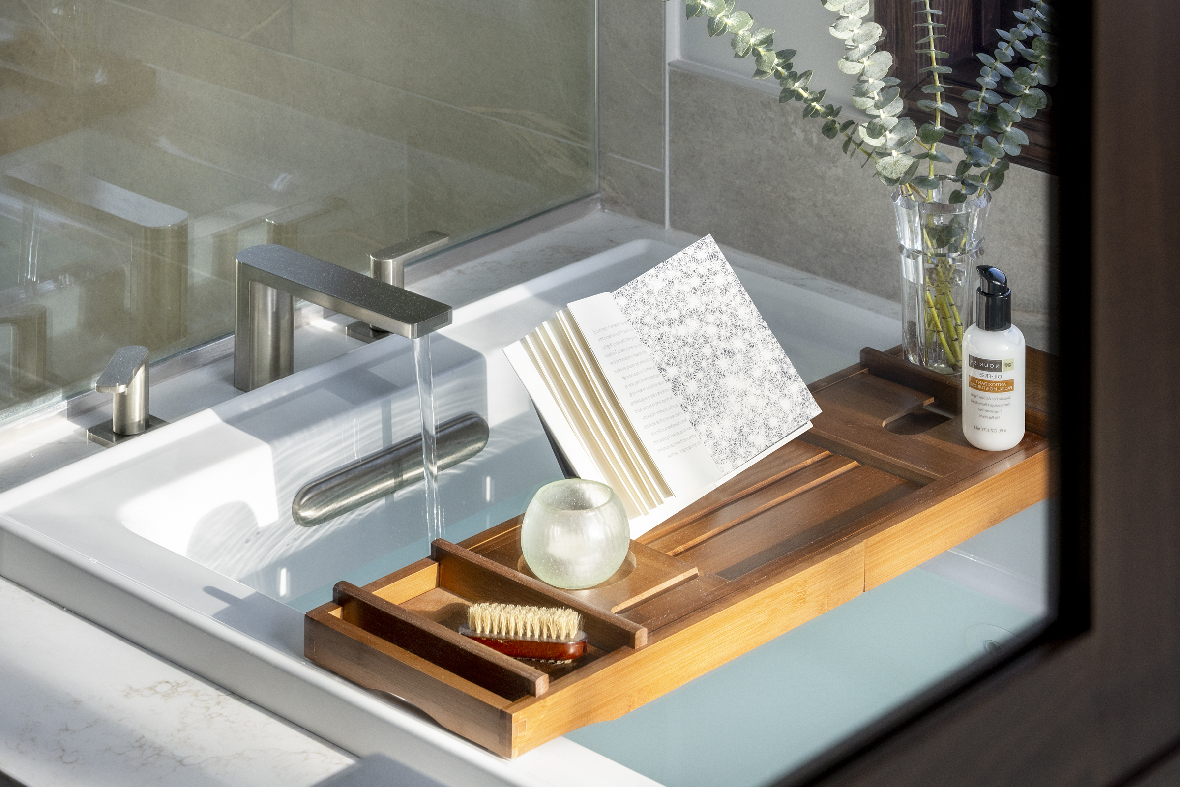 Primary bathroom remodel with large tub with bath wooden tray