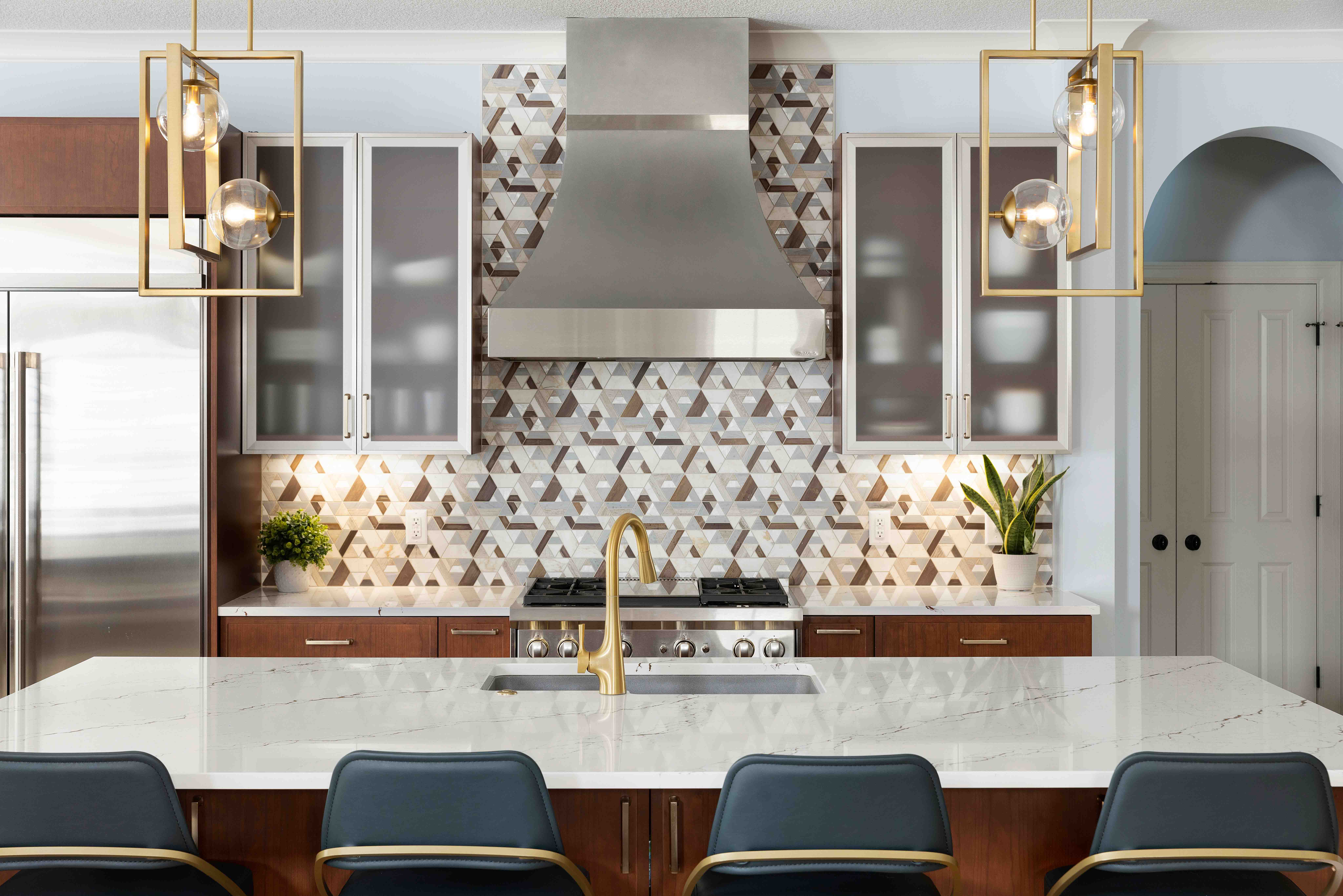 Kitchen remodel with mixed metal accents and patterned backsplash