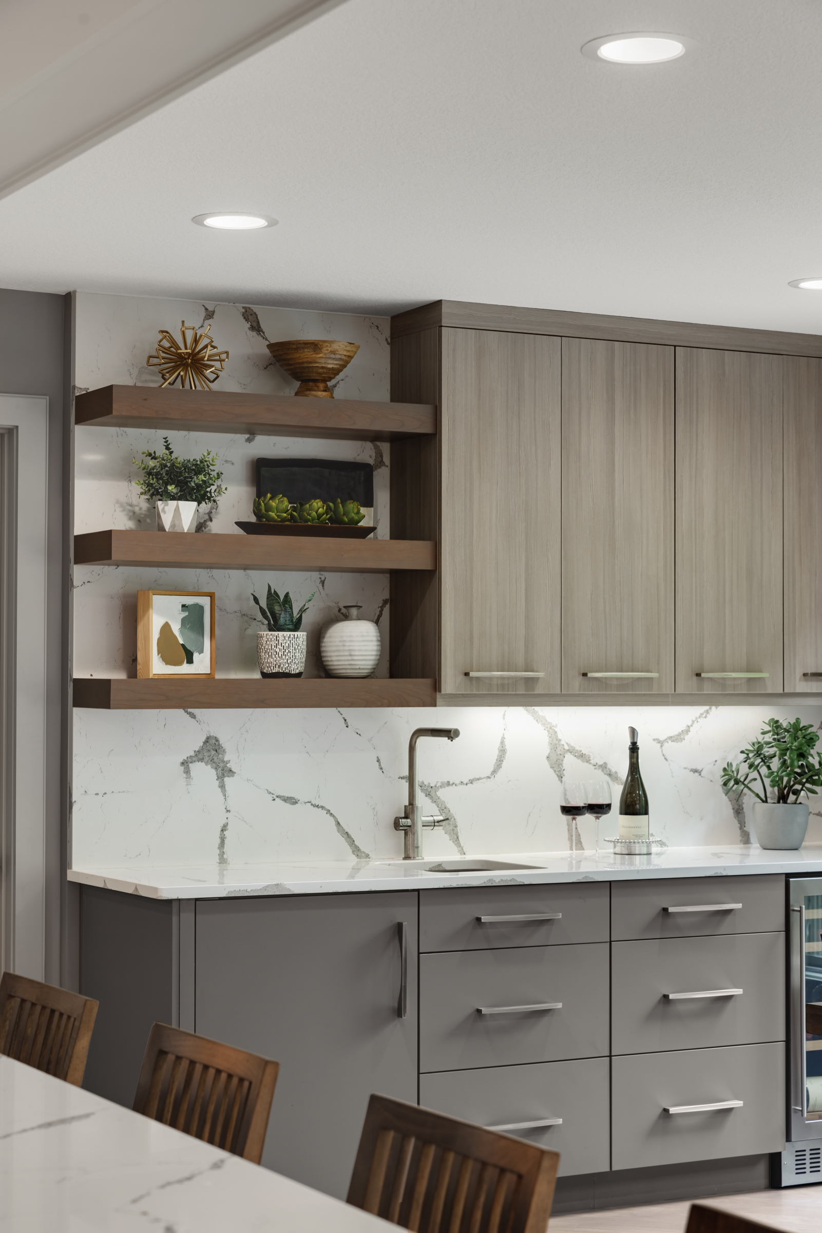 Contemporary kitchen remodel with flat panel light wood cabinets