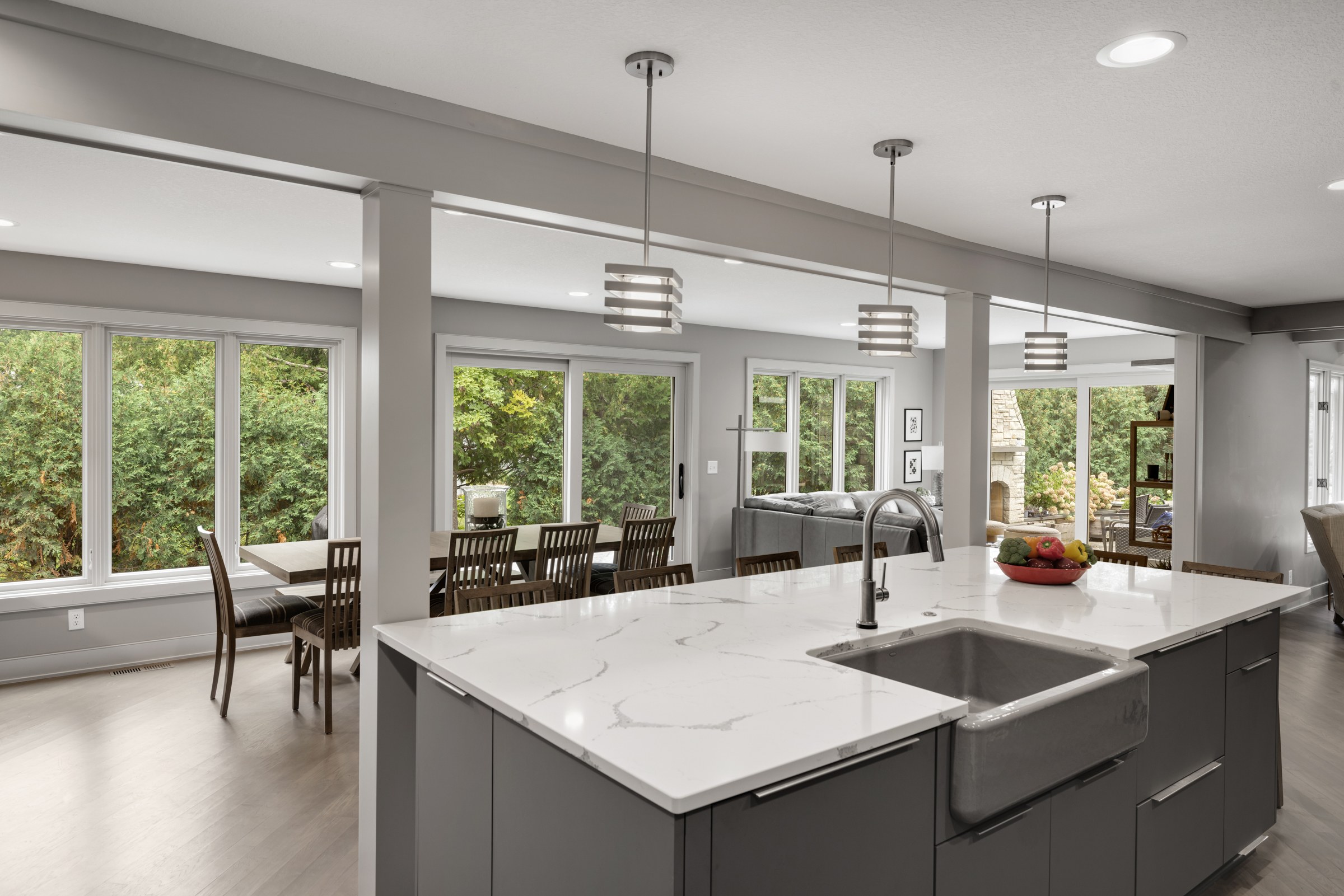 Kitchen addition with large windows and island that seats 6 people
