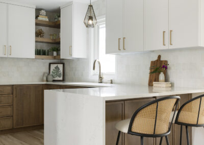 Kitchn remodel with white counters and hood, white upper cabinets, and wood base cabinets