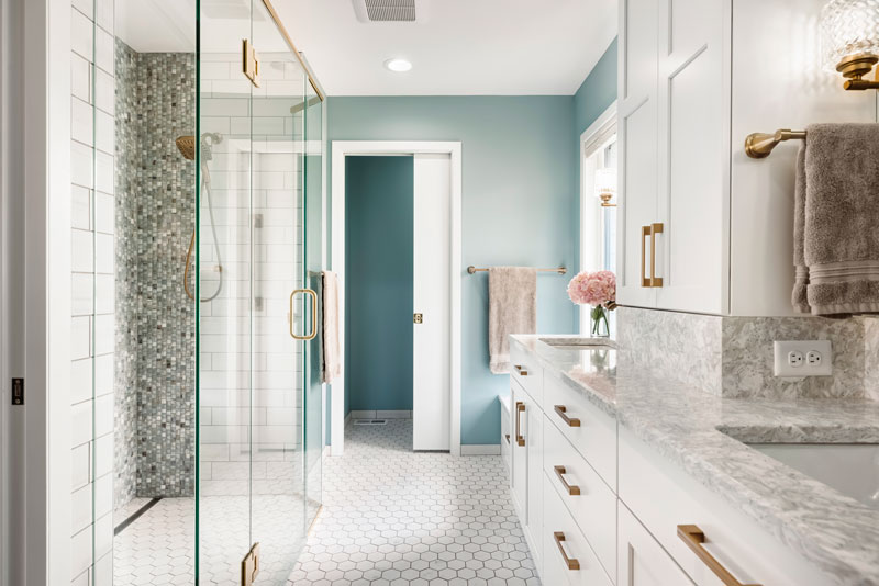 Portfolio-Bath European inspired bathroom remodel with light blue vanity and white tile floor